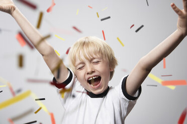 Boy in soccer jersey cheering - PDF000474