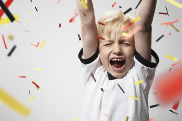 Boy in soccer jersey cheering - PDF000476