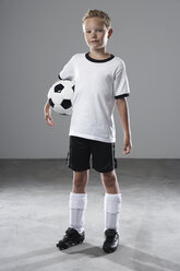 Boy in soccer jersey holding ball - PDF000486