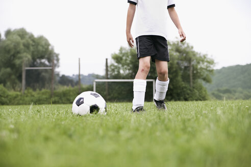 Boy in soccer jersey with ball - PDF000499
