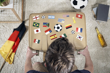 Soccer fan with national flags on suitcase - PDF000509