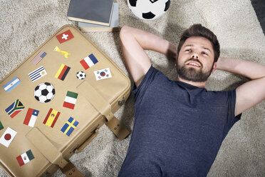 Soccer fan with national flags on suitcase - PDF000510