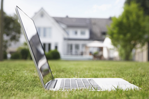 Germany, Cologne, Laptop in garden stock photo