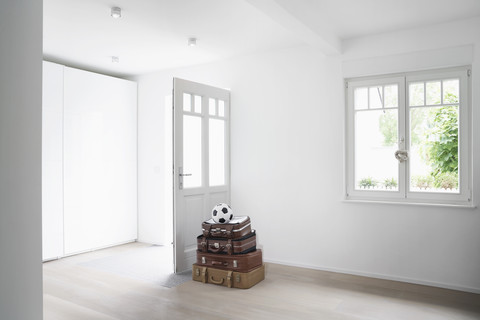 Germany, Cologne, Luggage in empty room stock photo