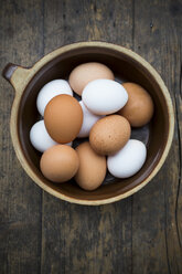 Eggs in bowl on wooden table - LVF000252