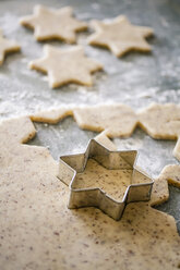 Cutting out star shaped Christmas cookies - SBDF000295