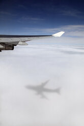 Jumbo jet, Boeing 747 in mid-air, view at clouds shadow of the airplane - RD001188