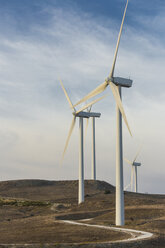 Spain, Andalusia, Cadiz, wind turbines standing on a field - KB000004