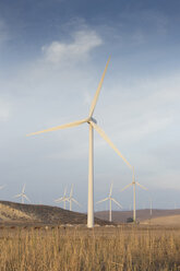 Spain, Andalusia, Cadiz, wind turbines standing on a field - KB000002