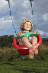 Little boy swinging in the garden - RDF001212