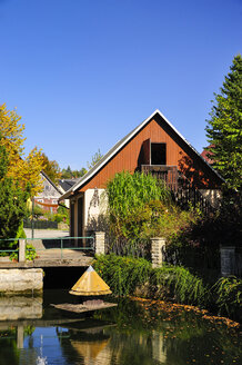 Germany, Saxony, Hinterhermsdorf, House at a pond - BT000210
