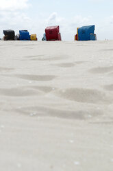 Germany, Amrum, Beach chairs in beach - AWDF000730