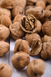 Walnuts on white wooden table, studio shot - ODF000645