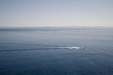 France, Corsica, Mediterranian Sea, view from Bonifacio, Boat in front of Sardinia Coastline - SBD000317