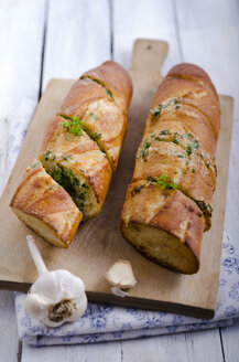 Sliced garlic bread garnished with parsley, studio shot - ODF000662