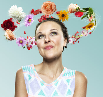 Young woman with flying flowers around her head, Composite - STKF000499