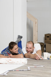 Young couple moving into new home, taking a break - FKF000311
