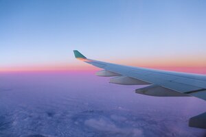 View of airplane wing over clouds - AMF001179