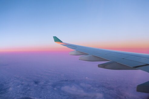 View of airplane wing over clouds - AMF001179