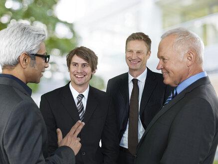 Conversation of four business men - STKF000514