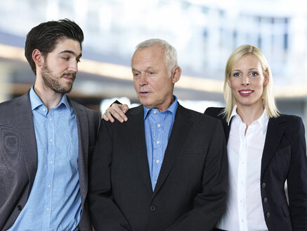 Portrait of two business men and a business woman - STKF000510