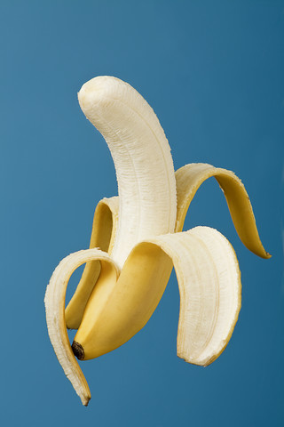 Half peeled banana (Musa) stock photo