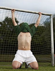 Soccer player celebrating on field - STKF000666