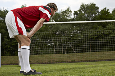 Exhausted soccer player on field - STKF000670