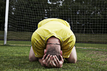 Frustrated soccer player on field - STKF000675