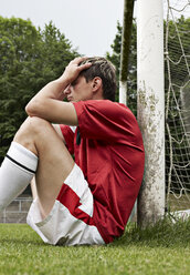 Frustrated soccer player on field - STKF000674
