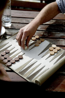Austria, Tyrol, Men playing backgammon - TKF000217
