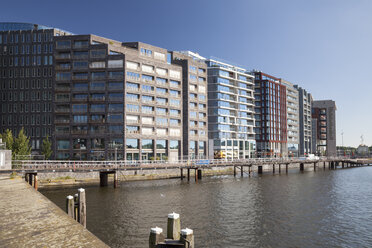 Netherlands, Amsterdam, Office buildings and library at town canal - WI000147