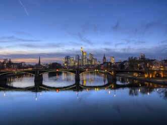 Germany, Hesse, Frankfurt am Main, financial district, Ignatz-Bubis-Bridge, skyline in the evening - AMF001195