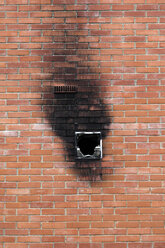 Spain, Burnt window in brick wall - JMF000249