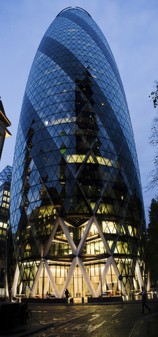 UK, London, London, 30 St Mary Axe, view to The Gherkin at dusk stock photo