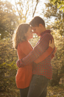 Happy young couple enjoying autumn in a park - BGF000002