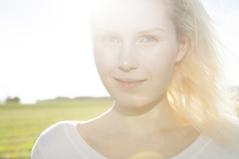 Portrait of smiling young woman, close-up stock photo