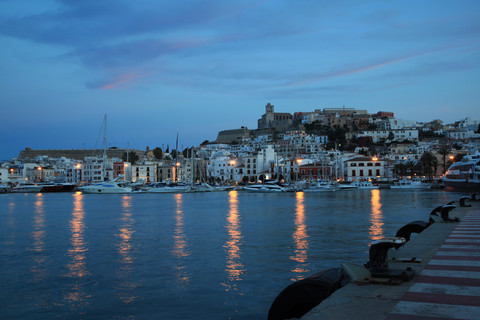 Spain, Ibiza, Harbour of Ibiza City at nightfall stock photo