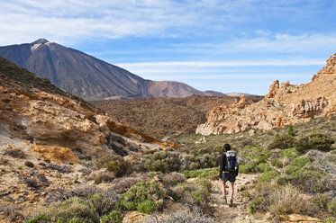Spain, Canary Islands, Tenerife, Roques de Garcia, Mount Teide, Teide National Park, Female hiker in the Caldera de las Canadas - UMF000681