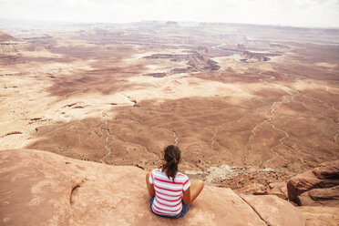 USA, Utah, Young woman looking over Canyonlands National Park - MBEF000890