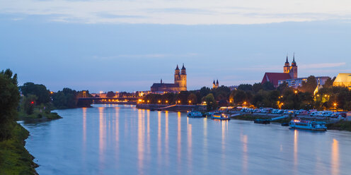 Germany, Saxony-Anhalt, Magdeburg, Cityscape with River Elbe at dusk - WDF002080