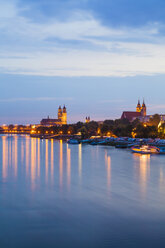 Germany, Saxony-Anhalt, Magdeburg, Cityscape with River Elbe at dusk - WDF002082