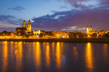 Germany, Saxony-Anhalt, Magdeburg, Cityscape with River Elbe, monastery and cathedral at dusk - WDF002084