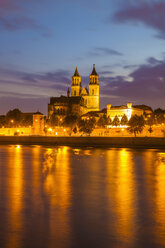 Germany, Saxony-Anhalt, Magdeburg, Cityscape with River Elbe and cathedral at dusk - WDF002085