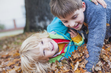 Two little boys playfighting - MJF000434