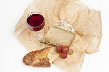 Tomme de Savoie cheese on wooden table - CSF020357