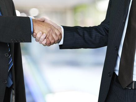 Two businessmen shaking hands - STKF000698
