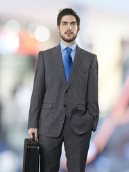 Portrait of businessman with briefcase - STKF000705