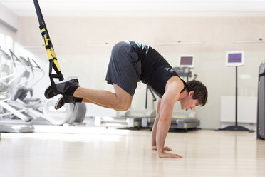 Austria, Klagenfurt, man at suspension training - DAWF000042