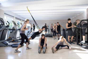 Austria, Klagenfurt, Multiple image of couple in gym - DAWF000067